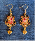 Ornate romantic red earrings with rhinestones in gold