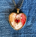 Romantic red marbled heart-shaped pendant in antique bronze